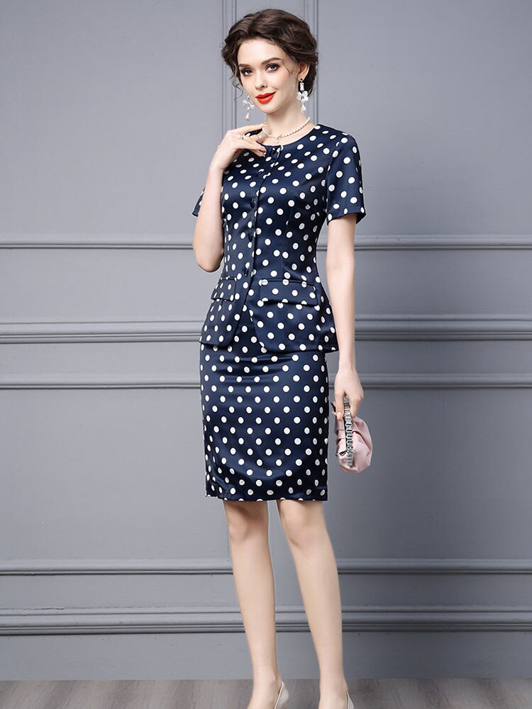 Experience on-trend style and timeless elegance with Robe Augusta. This two-piece women's outfit features an eye-catching dot print skirt blouse for a chic office look. Crafted from comfortable fabrics, you'll look stylish and feel confident all day. Make a statement with Robe Augusta.