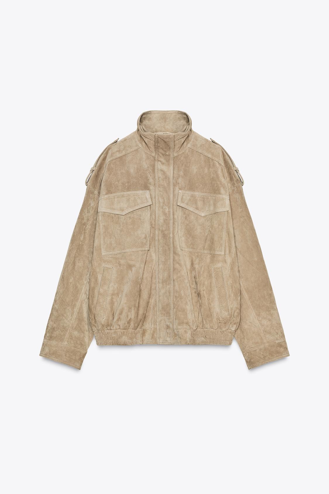 Elevate your style with this Suede Leather Jacket, featuring a high collar for added warmth and sophistication. The long cuffed sleeves with shoulder tabs add a touch of rugged elegance, while front and chest flap pockets combine functionality with fashion. The zip-up front is secured with a snap-button placket, ensuring both convenience and a sleek finish. Perfect for layering, this jacket offers a timeless look that effortlessly enhances any outfit.