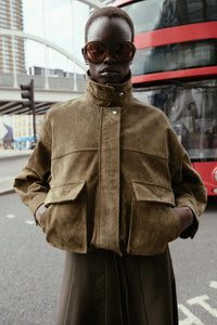 Bomber-style jacket made from 100% leather. Features a lapel collar and long sleeves. Front patch pockets with buttoned flaps. Concealed zip and snap-button fastening at the front.