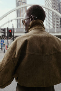Bomber-style jacket made from 100% leather. Features a lapel collar and long sleeves. Front patch pockets with buttoned flaps. Concealed zip and snap-button fastening at the front.