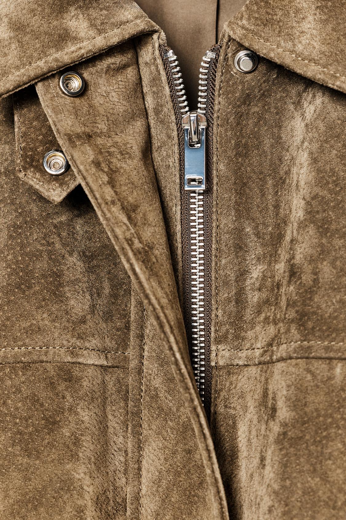 Bomber-style jacket made from 100% leather. Features a lapel collar and long sleeves. Front patch pockets with buttoned flaps. Concealed zip and snap-button fastening at the front.
