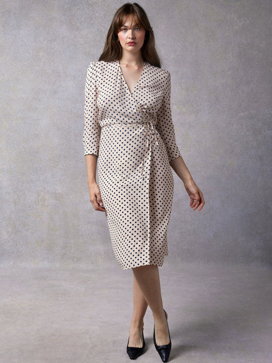 Indulge in luxury with the Robe Andra. This elegant polka dot midi wrap dress is perfect for any occasion. With its sophisticated design and flawless fit, it will elevate your style and make you feel exclusive. Wrap yourself in luxury and embrace the world of art, literature, and fashion with this stunning piece.