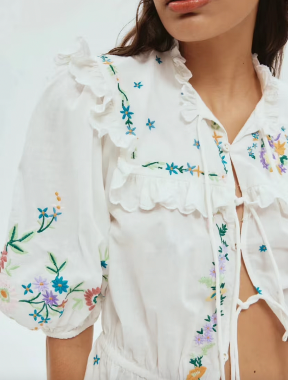 Effortlessly elevate your wardrobe with the Willa Embroidered Set. The tie front top with self-covered eyelet buttons and frill yoke detail add a touch of femininity, while the embroidered motif detail adds a unique touch. The elasticated drawstring waist and balloon sleeves provide a comfortable fit, making this set a must-have for any occasion.