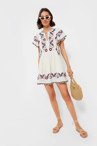 The Soren Embroidery Short Sleeve Dress by Sea New York features a split V-neckline and delicate embroidered detailing, combining elegance with effortless wearability. Its short flutter sleeves and gathered skirt create an A-line silhouette that offers a relaxed yet refined fit, ideal for versatile styling. In a cream multi palette, this mini dress balances romantic charm with modern ease, making it perfect for both casual days and more polished occasions. 
