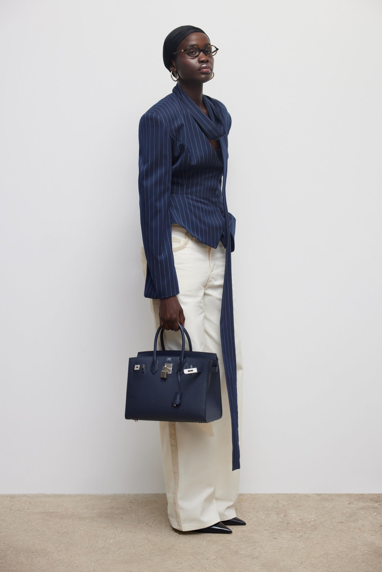 The Charlotte Jacket transforms your everyday style with its striking two-piece polka dot design. This sophisticated set pairs a commanding stand collar jacket with coordinating shorts, delivering effortless elegance for any occasion. Long sleeves and a relaxed silhouette create a polished look that doesn't compromise on comfort, making it ideal for weekend outings or evening plans. The playful dot pattern adds personality to your wardrobe while maintaining versatility across multiple settings. 