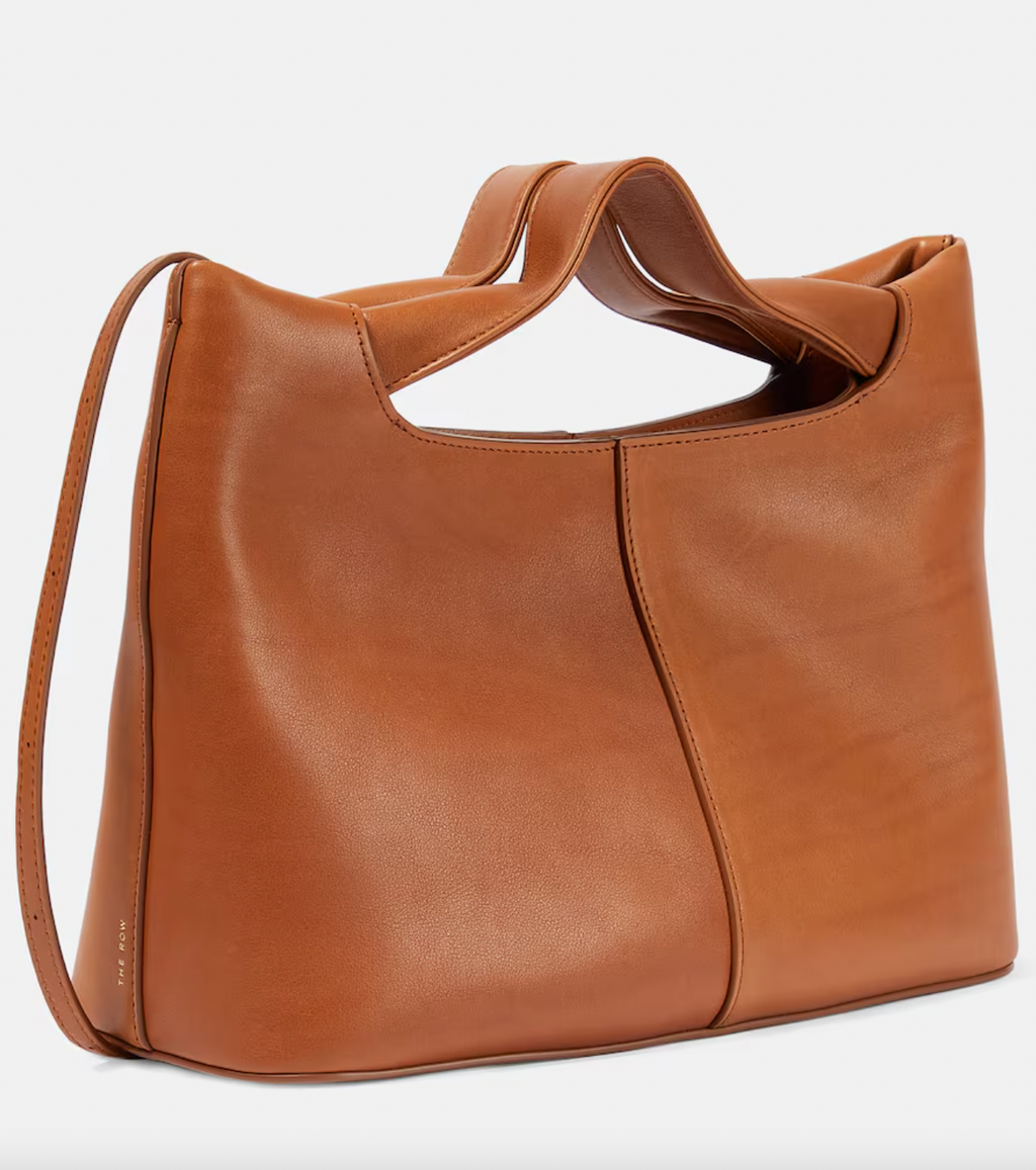 The Row's 'Camdem' tote has a slouchy, square silhouette with a handle that tucks into the top corner. It's made from supple leather and opens to a spacious interior with an internal zip pocket, so you keep small items like your lipstick from getting lost at the bottom.