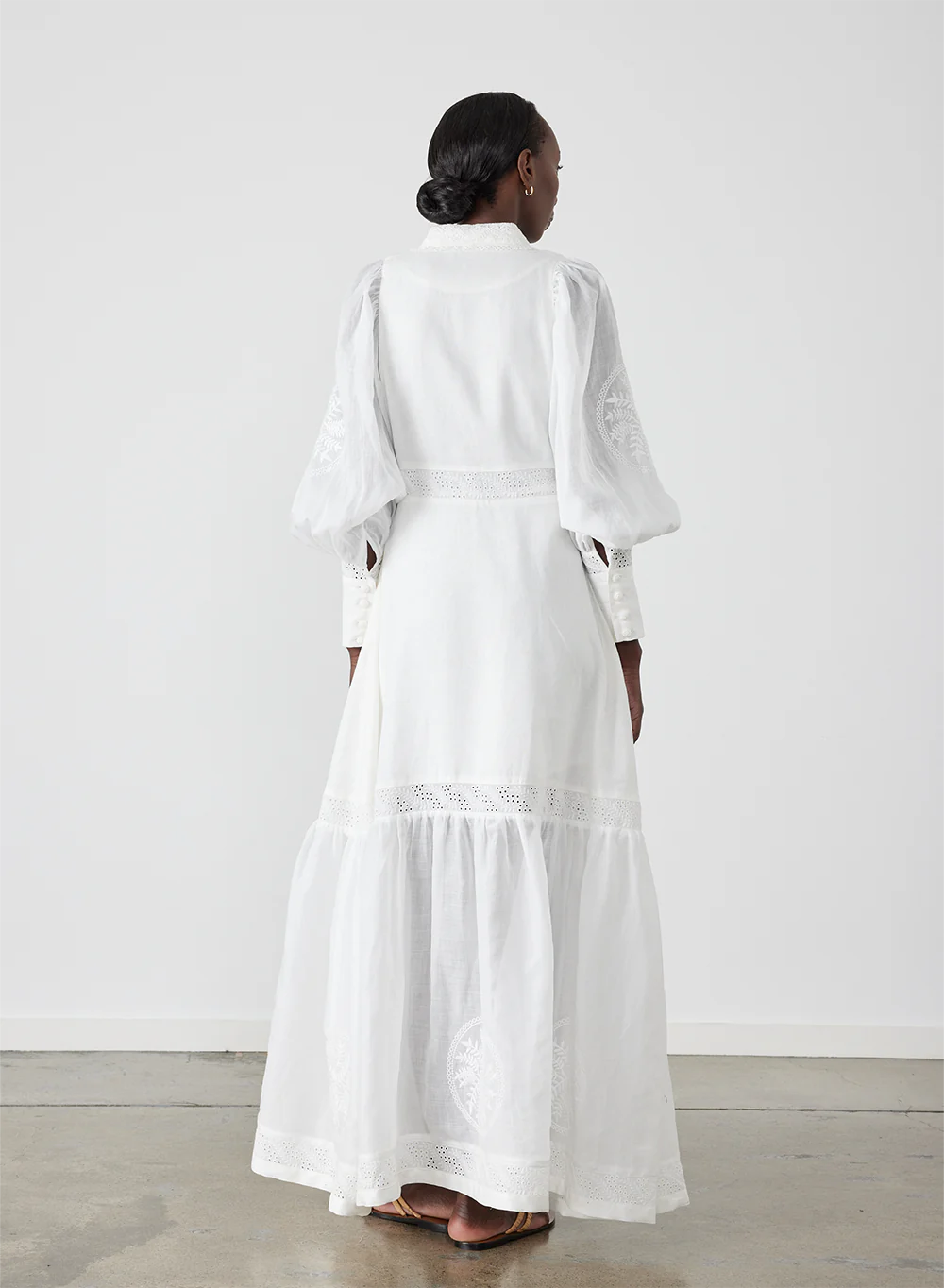 Indulge in luxury with Theodora Embroidery Dress by Joslin. The timeless shirt maxi dress boasts a classic collar and fit for a strong silhouette. The stunning ramie organdy sleeves and skirt hem panel add a touch of sophistication. Perfect for any occasion, elevate your wardrobe with this timeless piece.