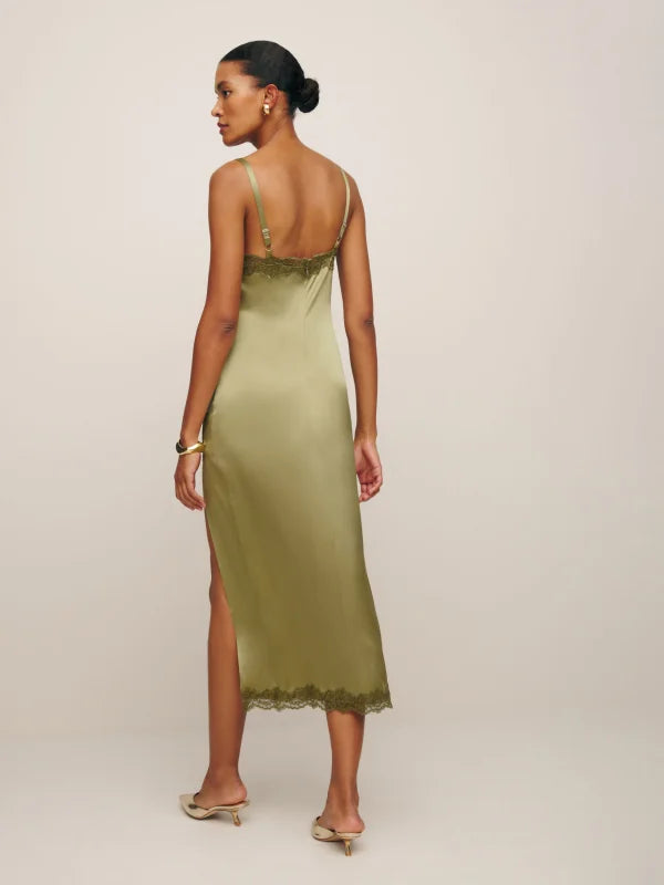 Indulge in pure luxury with the Karissa Silk Dress by Reformation. Crafted from sumptuous silk, this sleeveless midi dress features a flattering V-neckline and delicate lace hem. Perfect for any occasion, it exudes sophistication and elegance. Elevate your wardrobe and make a statement with this must-have piece.