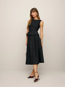 Create a stunning silhouette with our Moya Set. Designed to flatter with a fitted bodice and A-line skirt, this luxurious set is made from lightweight linen for a comfortable, yet chic look. Perfectly pairs with the Wilda Kitten Mule and Gale Velvet Pant for a truly elevated ensemble. Order now and experience the ultimate in sophistication and style.