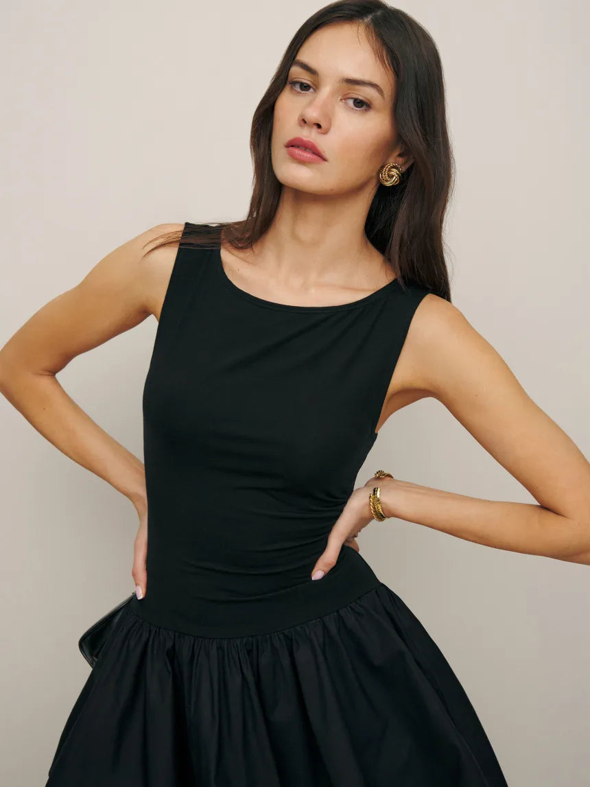 Elevate your style with the Defina Knit Dress. This luxurious piece features non-adjustable straps and a boat neckline for a sleek and sophisticated look. Crafted from 98% organic cotton and 2% spandex, the woven fabric offers both comfort and elegance. Upgrade your wardrobe with this exclusive dress.