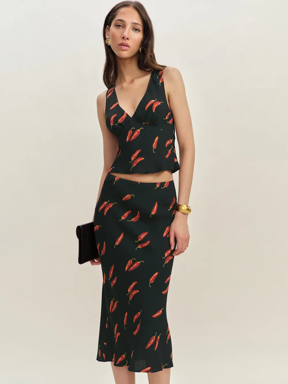 The Ryan Two Piece features a sophisticated v-neck design with a fully lined construction for a polished look. Crafted from lightweight, drapey crepe fabric, it offers a refined dry hand feel that enhances comfort and movement, making it ideal for stylish, effortless wear.