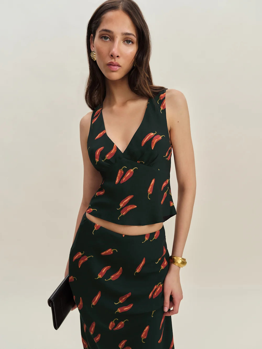 The Ryan Two Piece features a sophisticated v-neck design with a fully lined construction for a polished look. Crafted from lightweight, drapey crepe fabric, it offers a refined dry hand feel that enhances comfort and movement, making it ideal for stylish, effortless wear.