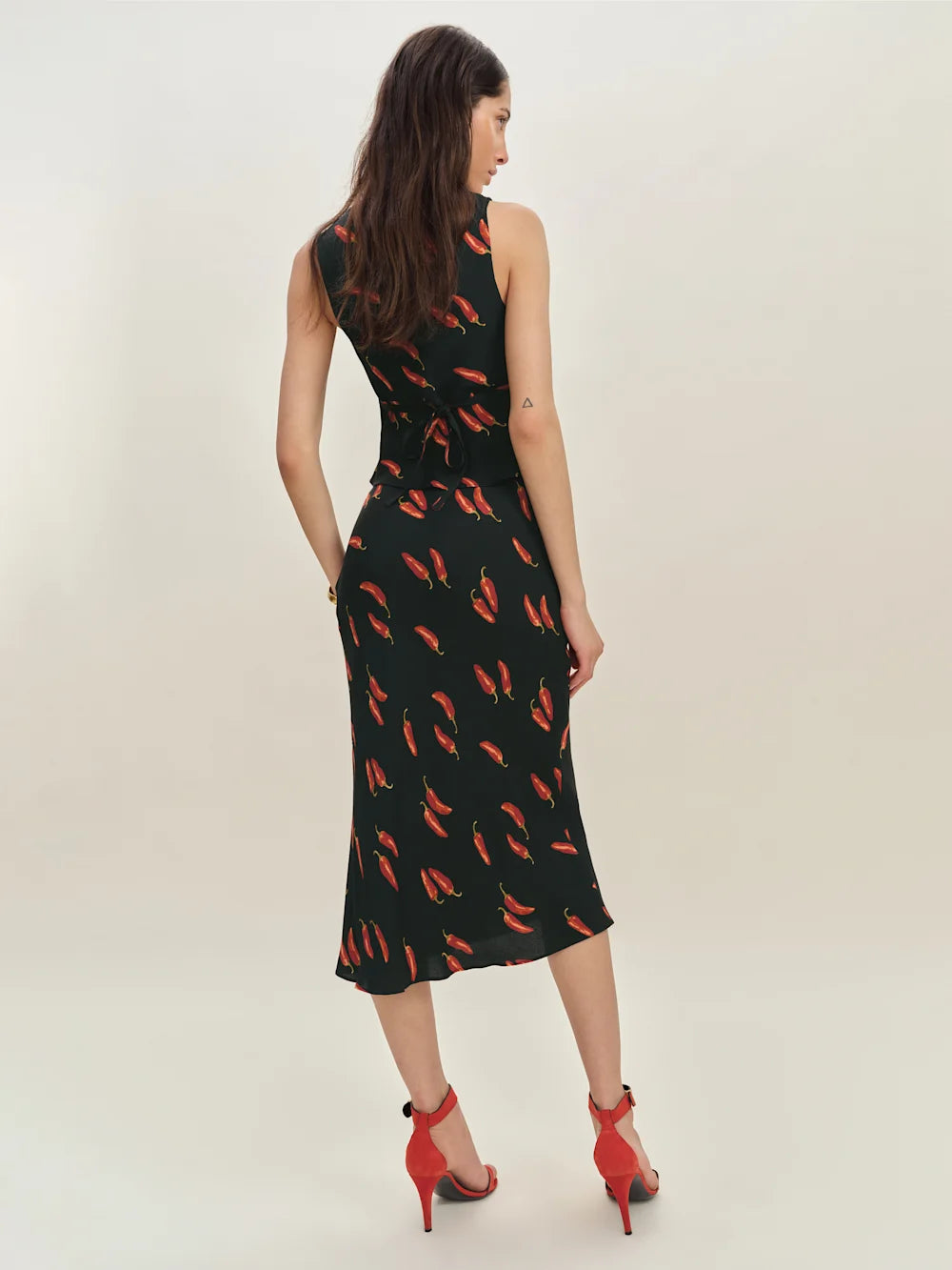 The Ryan Two Piece features a sophisticated v-neck design with a fully lined construction for a polished look. Crafted from lightweight, drapey crepe fabric, it offers a refined dry hand feel that enhances comfort and movement, making it ideal for stylish, effortless wear.