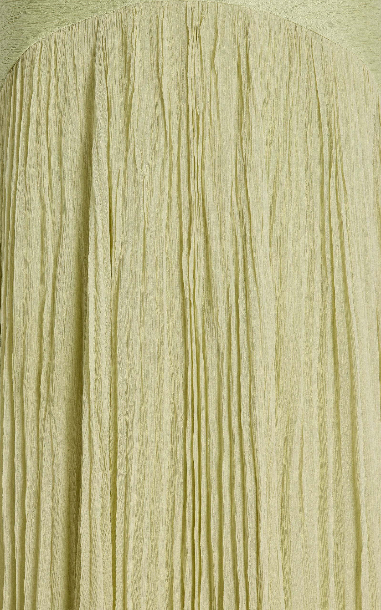 The Sunniva Plisse Strapless Gown showcases a fitted strapless bodice with a gracefully curved dropped waist, leading into a flowing plisse skirt that moves elegantly with every step. Its timeless silhouette emphasizes a refined, feminine shape, perfect for occasions that call for understated sophistication. Pair with statement earrings to elevate the look, capturing the essence of modern elegance.