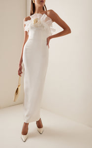 Crafted from a luxurious linen and silk blend, this midi dress features a fitted, boned bodice that shapes your silhouette beautifully. The flowing skirt moves gracefully with every step, while sparkling crystal embellishments catch the light to add an elegant shimmer. Perfect for making a lasting impression, this floral-print dress combines comfort with sophisticated style.