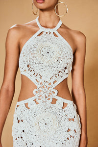 Be a true vision in the Accalia Crochet Gown by Cult Gaia. This masterpiece features hand-crocheted geometric and floral patterns, cutouts at the waist, and a halter neckline for an elegant and alluring look. The open back and adjustable neck tie allow for a perfect fit. Turn heads in this ankle-length gown!