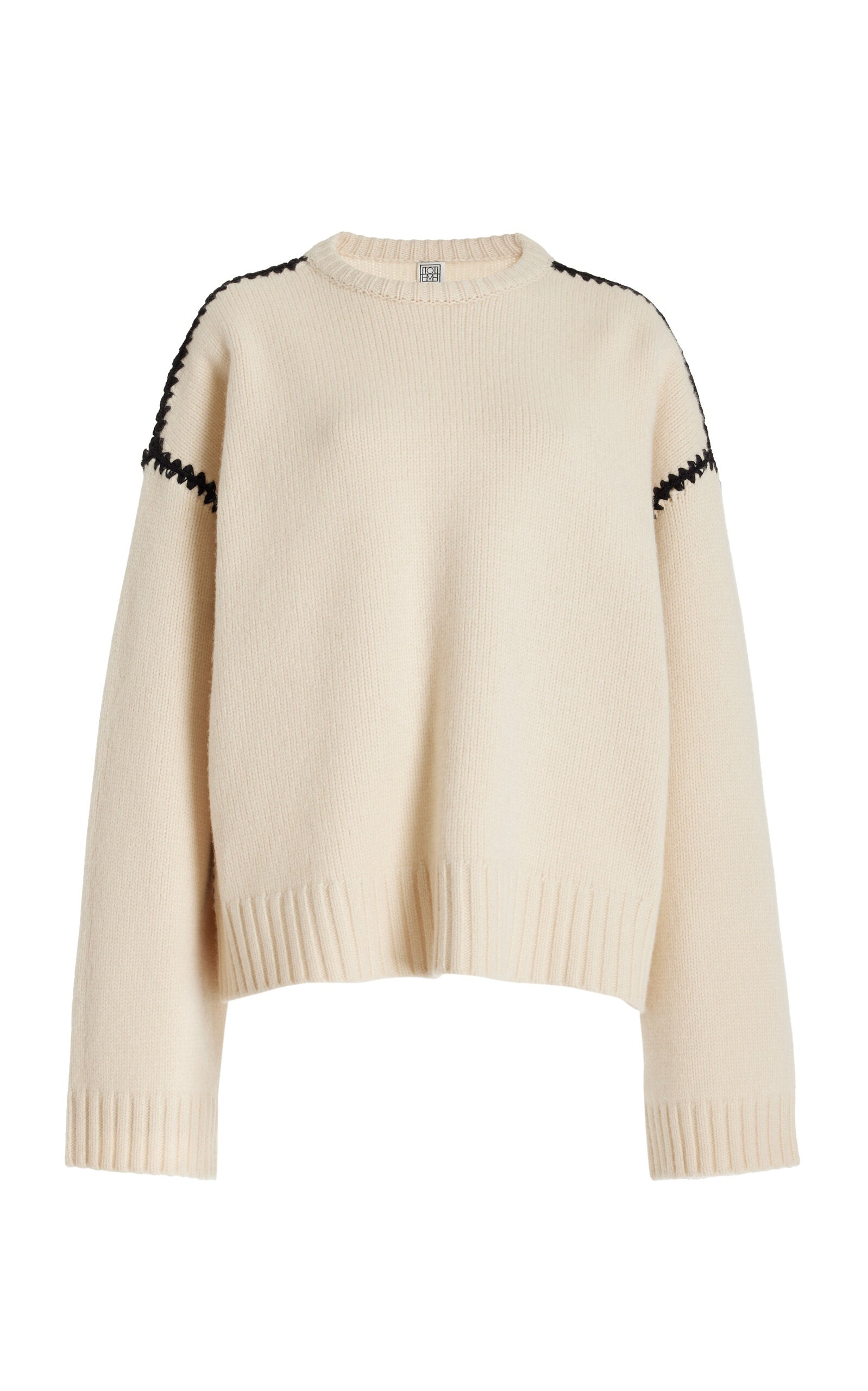 Embrace effortless Scandinavian style with this white wool-cashmere sweater by Totême. Crafted in a wide silhouette from mid-weight wool blended with cashmere, it offers cozy warmth and a soft touch. Intricate contrasting embroidery along the shoulders and armholes adds a refined, artisanal detail, elevating your everyday knitwear with subtle sophistication. Perfect for those who appreciate modern minimalism infused with a unique, handcrafted feel.