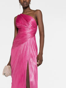 Indulge in luxury and sophistication with Maria Lucia Hohan's Esther One-shoulder Gown. Expertly crafted from lustrous silk, this floor-length gown features a striking metallic raspberry pink hue and a thigh-high slit for a modern touch. With elegant draped detailing, an open back, and a concealed zip fastening, this one-shoulder gown is the perfect addition to your wardrobe collection.