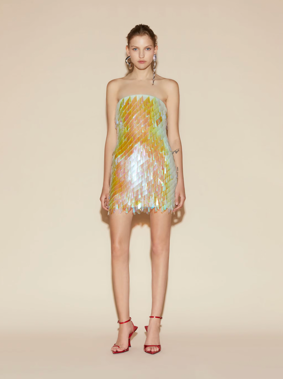 Glow up and stand out in The Attico's Sequin-embellished Mini Dress. This stunning minidress features an elegant square neckline and is crafted from luxurious silk. Its eye-catching embroidered opalescent teardrop sequins will make you the star of any event. Shine bright and feel confident in this must-have dress.