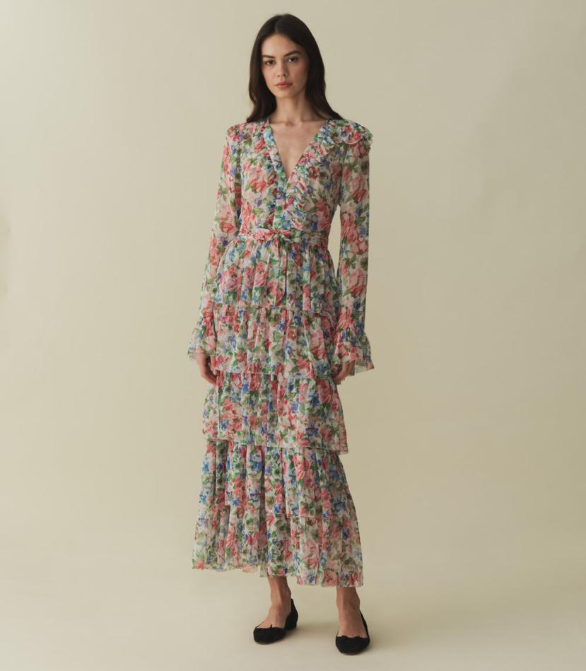 Embrace vintage glamour with the Melba Dress. Made from floaty silk georgette, this ‘70s-inspired dress features a plunging V-neckline and flared full-length sleeves for a feminine touch. The fitted waist with a fixed bow detail creates a flattering silhouette, while the invisible side zipper allows for easy wear. With its ankle-grazing skirt adorned with cascading ruffles, this dress will make you feel elegant and chic.
