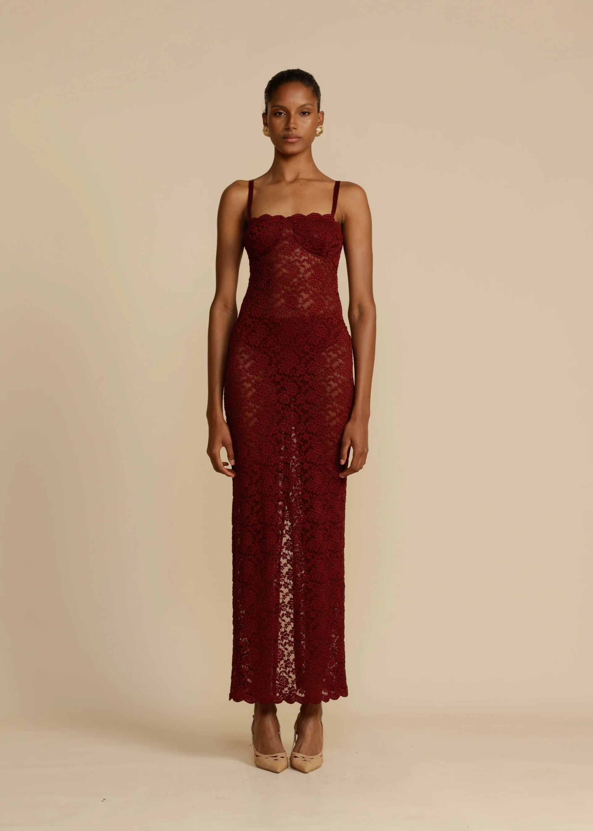 Elevate your evening look with Margot Lace Dress. This vintage-inspired lace dress in deep Wine exudes seductive allure and classic glamour. Featuring a semi-sweetheart neckline and a floor-length maxi with a center back split, Margot compliments your curves and allows for custom adjustments with gold fastenings on the shoulder straps. Lined at the bust for coverage and support, Margot is the perfect blend of comfort and sophistication.