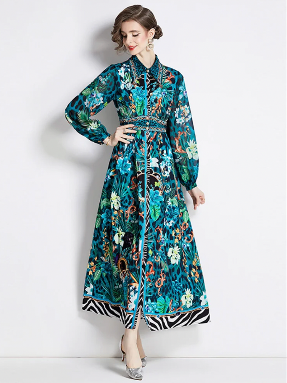 The Robe Nora is a trendy and elegant maxi dress, perfect for any occasion. Its soft green floral design adds a touch of femininity, while the turn down collar and long sleeves provide a sophisticated look. With the added feature of buttons, this dress is as functional as it is fashionable. Elevate your wardrobe with this versatile and stylish piece.