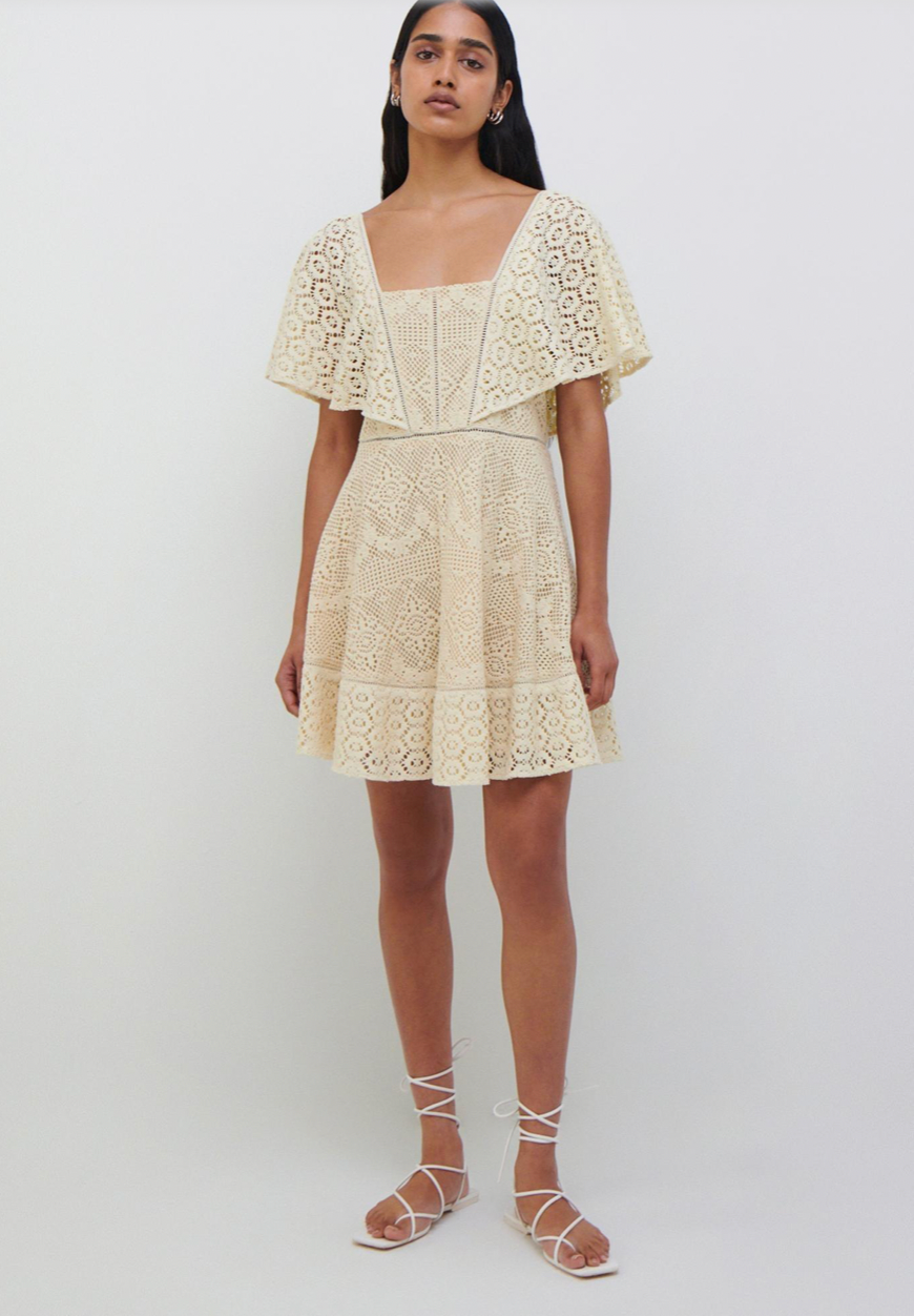 Get ready to turn heads at the beach or pool with our Avalon Crochet Coverup Dress! With its square neckline and flutter sleeves, this flirty and flounced mini dress is a must-have for your summer wardrobe. The intricate crochet design adds a touch of elegance to make you stand out.