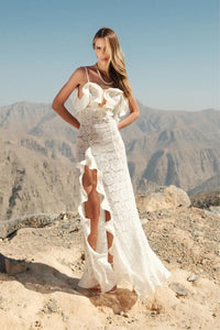 The Elisabetta dress is a graceful maxi length gown that emphasizes femininity and gives the a sophisticated look. A plunging neckline on the back adds a touch of seductiveness, while delicate organza ruffles and adjustable straps provide comfort and a perfect fit. This dress is created individually to emphasize your uniqueness and give you a sense of exclusivity.