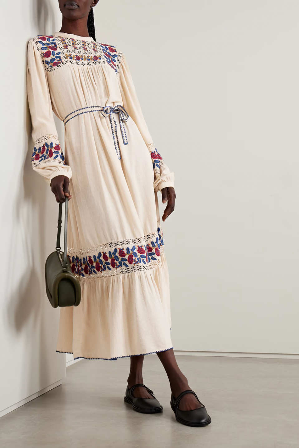 Indulge in the luxurious Nan Embroidered Silk-voile Dress by SEA NY. This intricately detailed midi dress boasts colorful embroidery and crochet trims, elevating its vintage charm. The gathered tiers of silk-voile create a loose and billowy silhouette, while the whipstitched belt cinches the waist for a flattering fit. Perfectly paired with ballet flats or lace-up sandals.