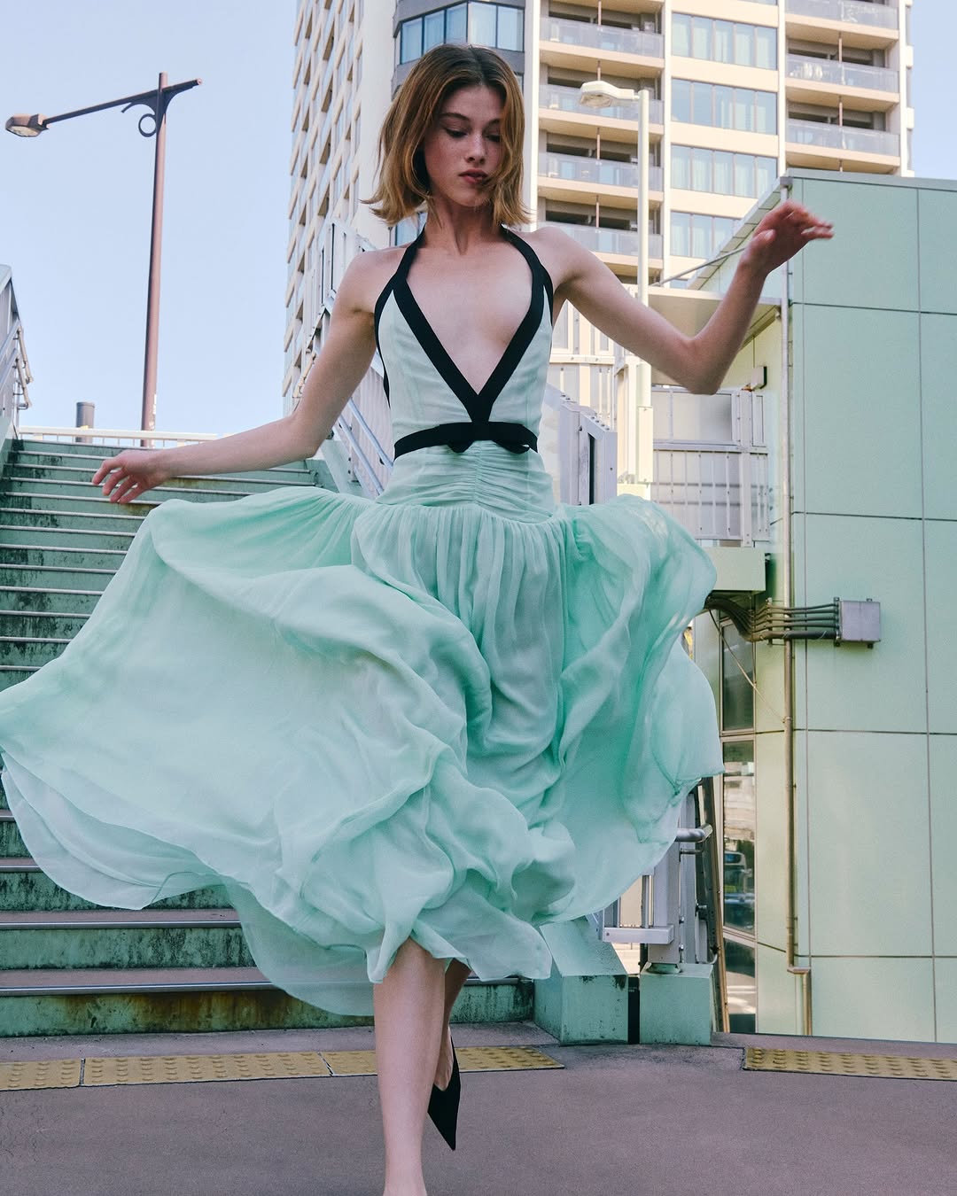 The Siren Dress in Mint by Helsa is engineered for those who embrace bold fashion statements. This sleeveless bodycon maxi features a striking plunging V-neckline and open back that exude confidence and allure. Contrast mesh patchwork adds contemporary visual interest, while pleated skirt detailing creates graceful movement. The secure halter construction delivers support without compromising the dress's daring aesthetic. 