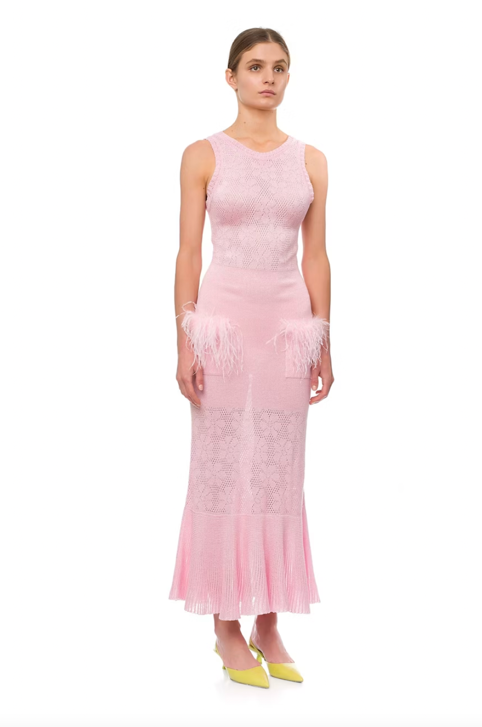 Make a statement with Andreeva's Knit Midi Dress, adorned with delicate feathers. The elegant round neck and figure-flattering design exude sophistication, perfect for any occasion. Elevate your style with heels or go for a more casual look with sandals or sneakers. Be confident and chic in this must-have dress.