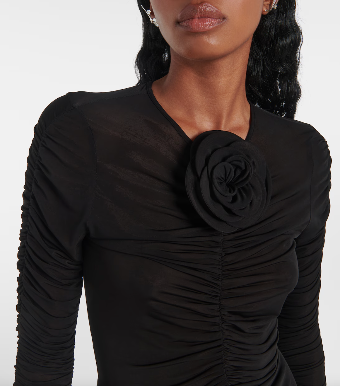 Elevate your style with the exquisite Magda Butrym Floral-appliqué ruched top. Made from a luxurious blend, this designer top boasts delicate floral appliqués and a flattering ruched design for a sophisticated look. Complete with a hook-fastening back closure, add this versatile piece to your wardrobe for a fashion-forward touch. Made in Poland.