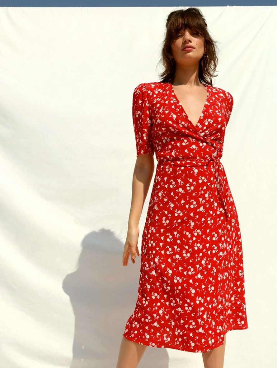 Introducing the stunning Allison Dress, with a striking red floral print that will make you stand out in any occasion. The V-neck and short sleeves provide a perfect balance of comfort and style, while the midi length adds a touch of elegance. Elevate your summer wardrobe with this vintage-inspired dress.