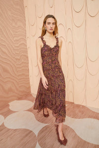 Expertly crafted from lightweight silk crinkled chiffon, the Rosaria Dress boasts a playful micro-painted leopard print in shades of pink and brown. This sleeveless midi dress features delicate ruffle trims, a flattering silhouette, and a hidden back zipper for easy dressing. Fully lined for added comfort.