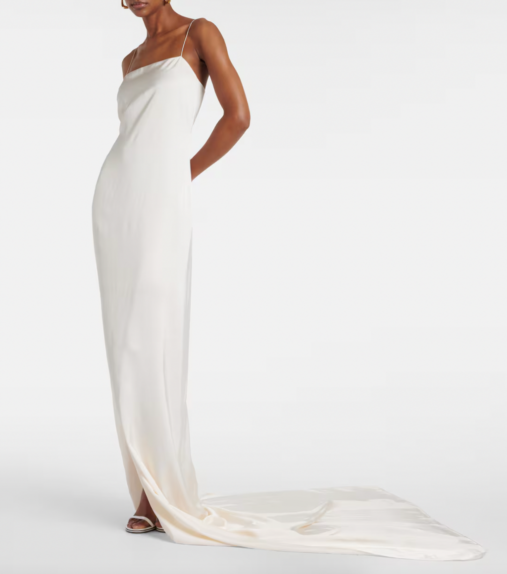 Experience effortless elegance with the La Robe Noiva satin gown by Jacquemus. Crafted from luxurious satin, this gown drapes beautifully to highlight your silhouette with understated sophistication. Its sleek design offers a modern, refined look perfect for special occasions, ensuring you stand out with timeless charm. Elevate your wardrobe with this statement piece that combines comfort and high fashion seamlessly.
