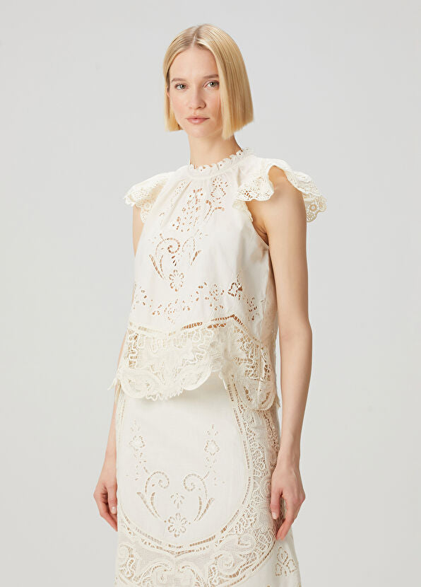 Elevate your wardrobe with the Gianna Bone Lace Blouse by SEA, featuring a refined mandarin collar that adds subtle sophistication. Delicate lace and ruffle details enhance its tank top design, blending elegance with breathable comfort. Ideal for layering or wearing alone, this blouse offers a polished look perfect for both professional settings and stylish casual occasions.