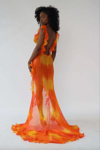 Experience luxury with our Dress Sunset. Made from hand painted silk burn-out chiffon, this dress is one of a kind. Each dress is unique due to the hand painted fabric, making it a true work of art. Elevate your wardrobe with this exclusive and elegant piece.