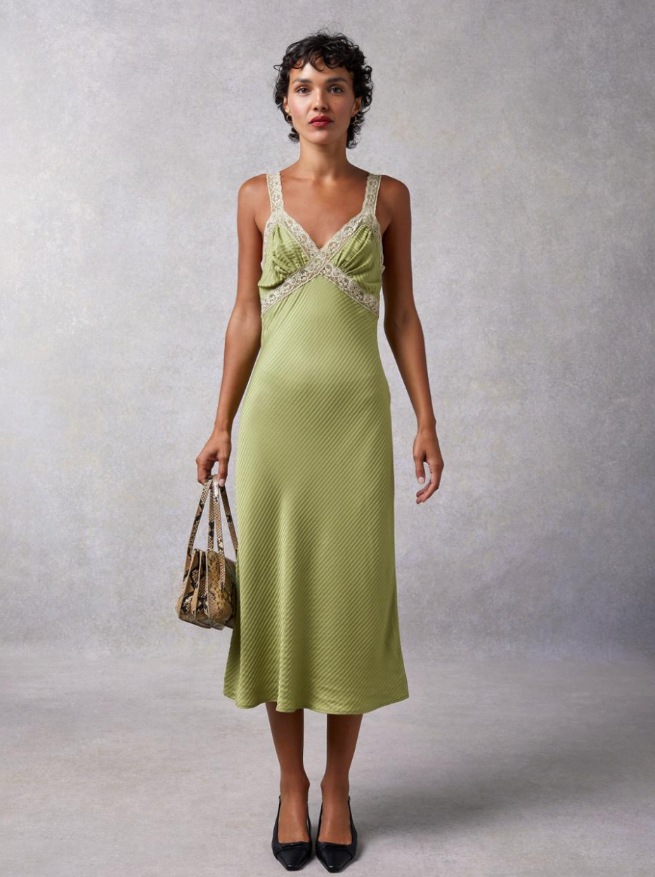 Embrace effortless elegance with the Jenna Dress Jacquard. The flowing midi dress in Linden color features a striped jacquard pattern and delicate lace straps, creating a timeless and flattering silhouette. The bias cut and lace inlay on the neckline add a touch of feminine charm. Elevate your style with this must-have dress.