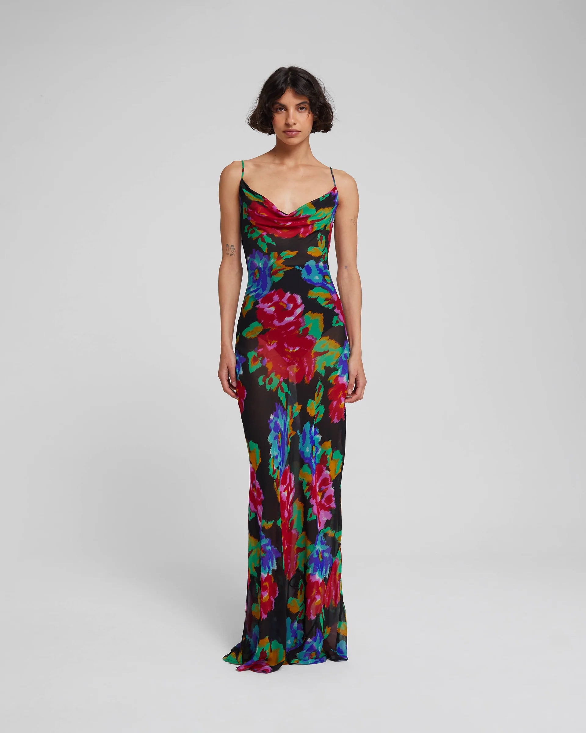 Indulge in the drama of the Casablanca Maxi Dress. Its sleek silhouette and oversized print will turn heads, while the sheer finish adds a touch of allure. Cut on the bias, it molds to your body for a flattering draped effect. A must-have for an effortlessly sophisticated look.