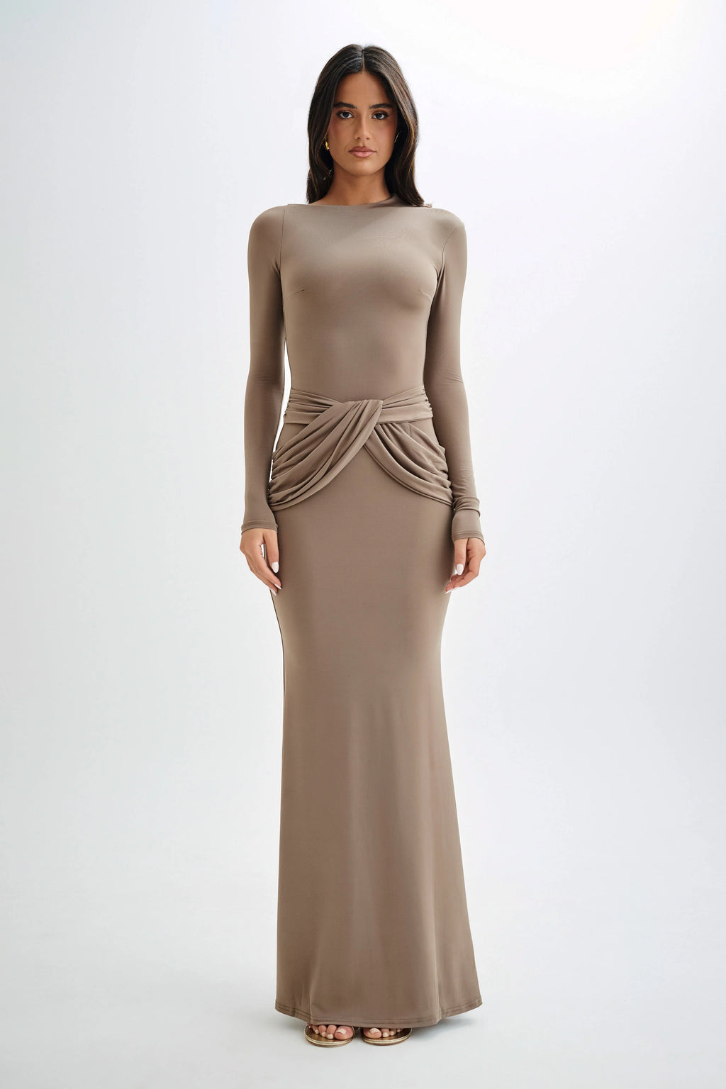 Introducing the Dasha Maxi Dress - a stunning choice for any formal occasion. This long sleeve slinky dress boasts an asymmetrical neckline and twist overlay detailing, creating a sleek and sophisticated silhouette. The flowing fishtail hem and maxi length add a touch of drama, while the fully lined design ensures comfort. Elevate your style with this elegant and exclusive dress.