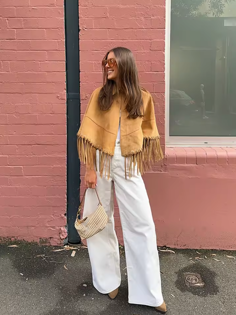 Elevate your wardrobe with this camel brown fringed cape by Maje. Its classic collar and curved hem create a graceful silhouette, while the front hook and eye closure ensures a sleek finish. Fully lined for comfort, this cape adds a sophisticated layer that complements any outfit with subtle texture and timeless charm. Perfect for those seeking effortless style and refined warmth.