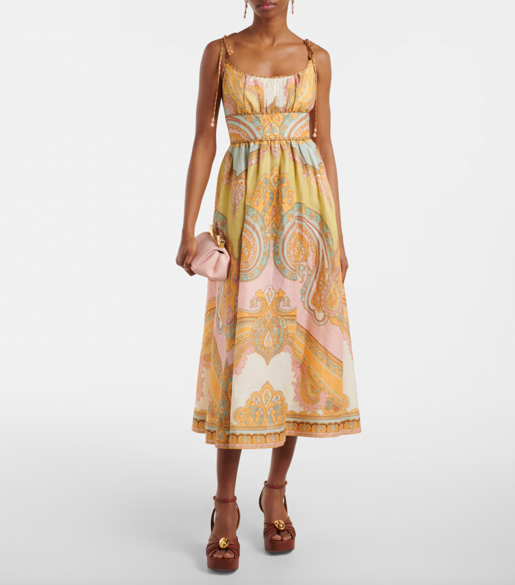 Elevate your wardrobe with the Maxine Picnic paisley linen bustier dress from Zimmermann. This midi-length dress showcases a timeless paisley placement print on breathable linen, highlighting a fitted bustier with delicate gathering and flat piping for a flattering silhouette. Self-tie straps offer adjustable comfort, while side seam pockets add practical charm. Perfect for warm days and stylish gatherings, this dress effortlessly combines elegance and ease.