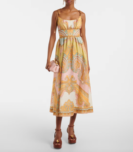 Elevate your wardrobe with the Maxine Picnic paisley linen bustier dress from Zimmermann. This midi-length dress showcases a timeless paisley placement print on breathable linen, highlighting a fitted bustier with delicate gathering and flat piping for a flattering silhouette. Self-tie straps offer adjustable comfort, while side seam pockets add practical charm. Perfect for warm days and stylish gatherings, this dress effortlessly combines elegance and ease.