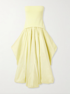 Experience elegance with SIMKHAI’s Izzy Stretch-knit and Gathered Taffeta Midi Dress. Featuring a fitted stretch-knit bodice and a voluminous taffeta skirt in a radiant Sunglow yellow, this strapless design sculpts your silhouette with a gathered waist and an eye-catching asymmetric bubble hem. Perfectly balanced and uniquely stylish, it’s an unforgettable choice for making a bold, sophisticated statement.