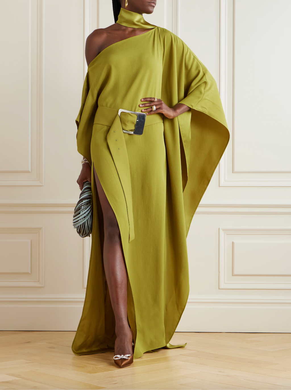 Taller Marmo's 'Taylor' kaftan is the epitome of easy elegance. Made from cady, it has a one-shoulder neckline framed by a scarf and cinches at the waist with a 'Space-age'-inspired buckled belt. Complement the deep thigh split with your highest heels.