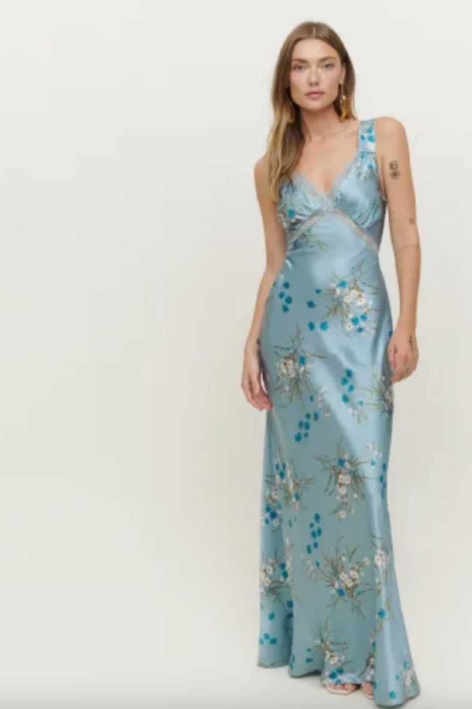 Feel confident and stunning in our Chania Silk Dress from Reformation! This v-neckline maxi dress features elegant lace detailing and a center back cut out with 3 button closures. The supportive design is perfect for all body types, and the dress is sure to make you feel like a total goddess. Pair with heels for a stunning look.