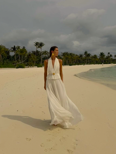 Indulge in luxury with the White Silk Skirt and Top Set. Made of the finest double layered Silk Tulle, this set exudes elegance and quality. With a hidden elastic waist, the skirt offers a perfect fit while the top adds a touch of delicacy. Perfect for any special occasion.