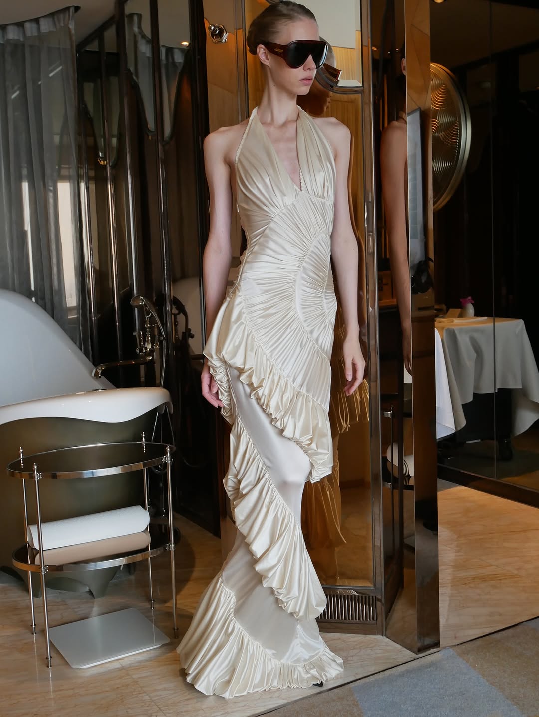 The Ammonite Gown by Datt combines elegance with practical comfort. Crafted from soft mesh that drapes beautifully against your skin, this fitted piece features a convenient side zip for effortless dressing. The included separate bikini lining ensures you're covered and confident underneath, making this gown versatile enough for any occasion where you want to feel polished and put-together.