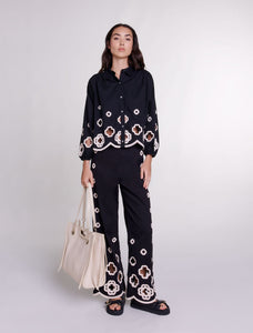 Elevate your style with the Ensemble Jocelyn! This chic set features a lace pantsuit with a retro lapel and long lantern sleeves, adorned with a hook flower hollow out design. It's perfect for making a bold statement while staying comfortable and stylish. Get yours now!