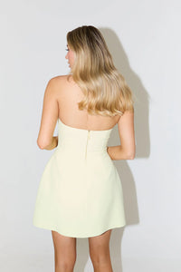 Introducing the Structured Mini Dress, the epitome of elegance and sophistication. Featuring a classic halter neck and lampshade skirt, it's a timeless piece that will elevate your style. With our signature cinch and Resort lime cream color, this dress is perfect for any event as it combines refinement with a touch of playfulness.